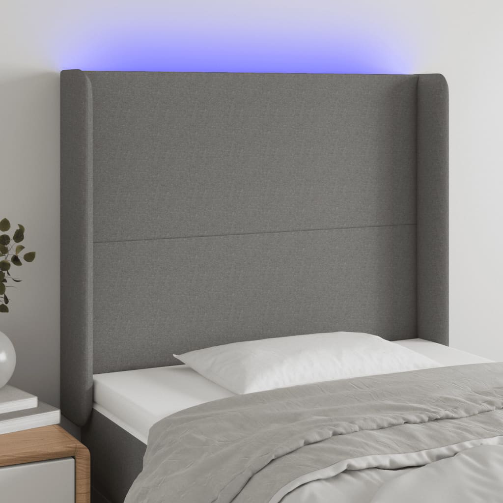 Čelo postele s LED tmavě šedé 83 x 16 x 118/128 cm textil
