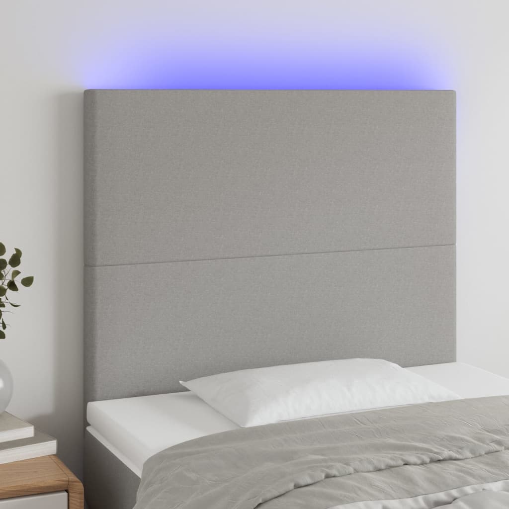 Čelo postele s LED světle šedé 100x5x118/128 cm textil