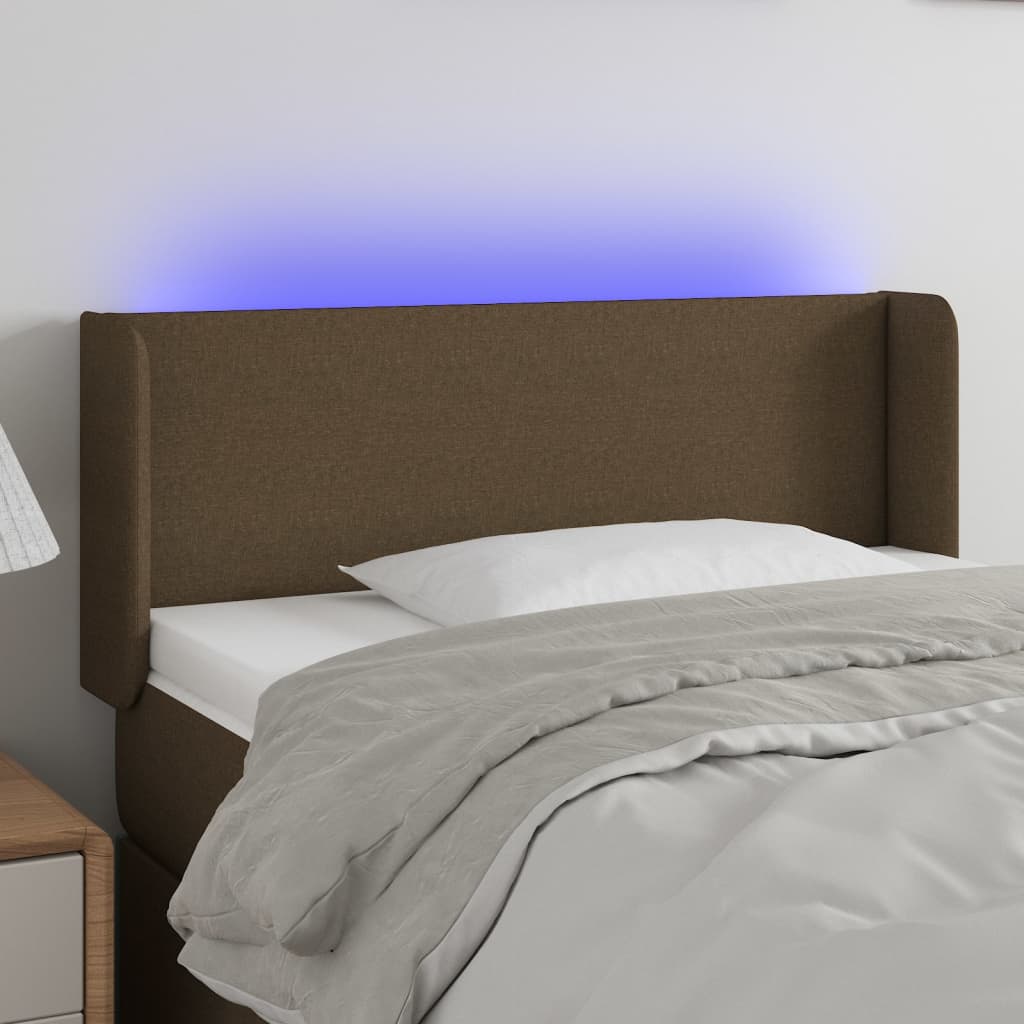 Čelo postele s LED tmavě hnědé 83 x 16 x 78/88 cm textil