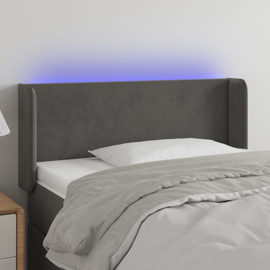 Čelo postele s LED tmavě šedé 83 x 16 x 78/88 cm samet