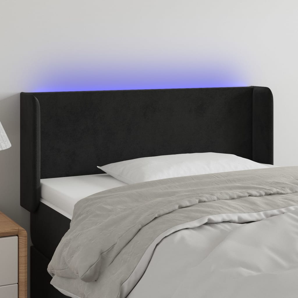 Čelo postele s LED černé 103 x 16 x 78/88 cm samet