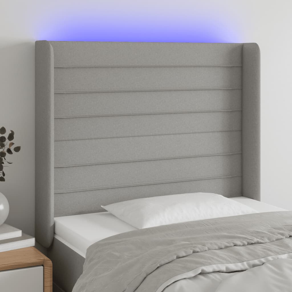 Čelo postele s LED světle šedé 93x16x118/128 cm textil