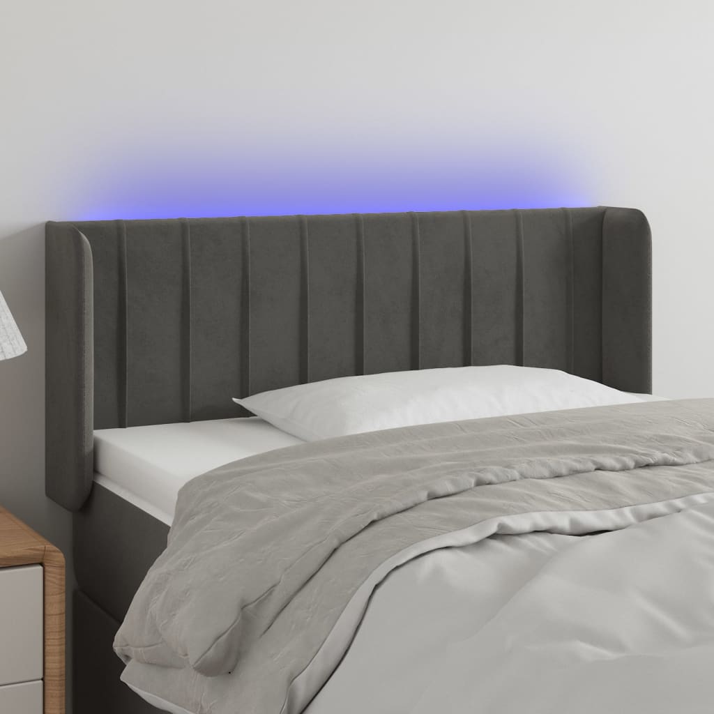 Čelo postele s LED tmavě šedé 103 x 16 x 78/88 cm samet