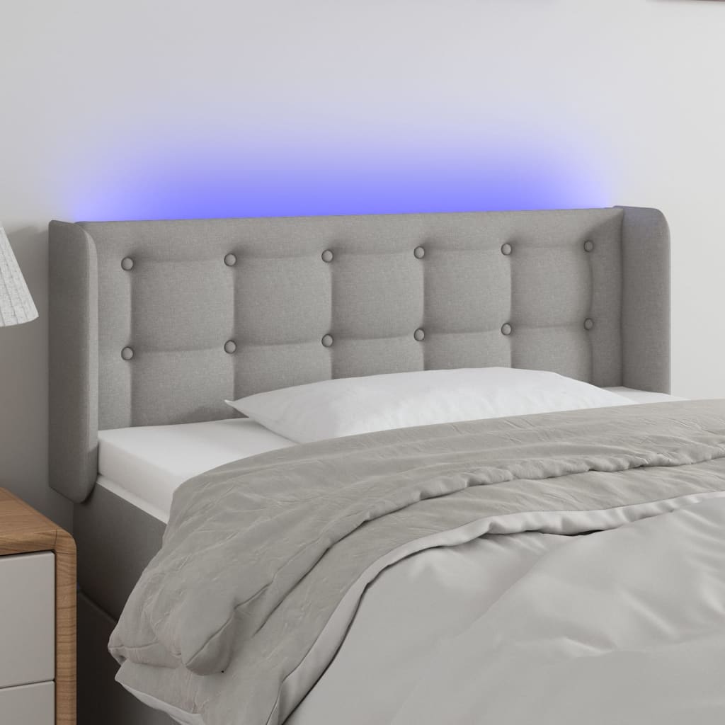 Čelo postele s LED světle šedé 93 x 16 x 78/88 cm textil