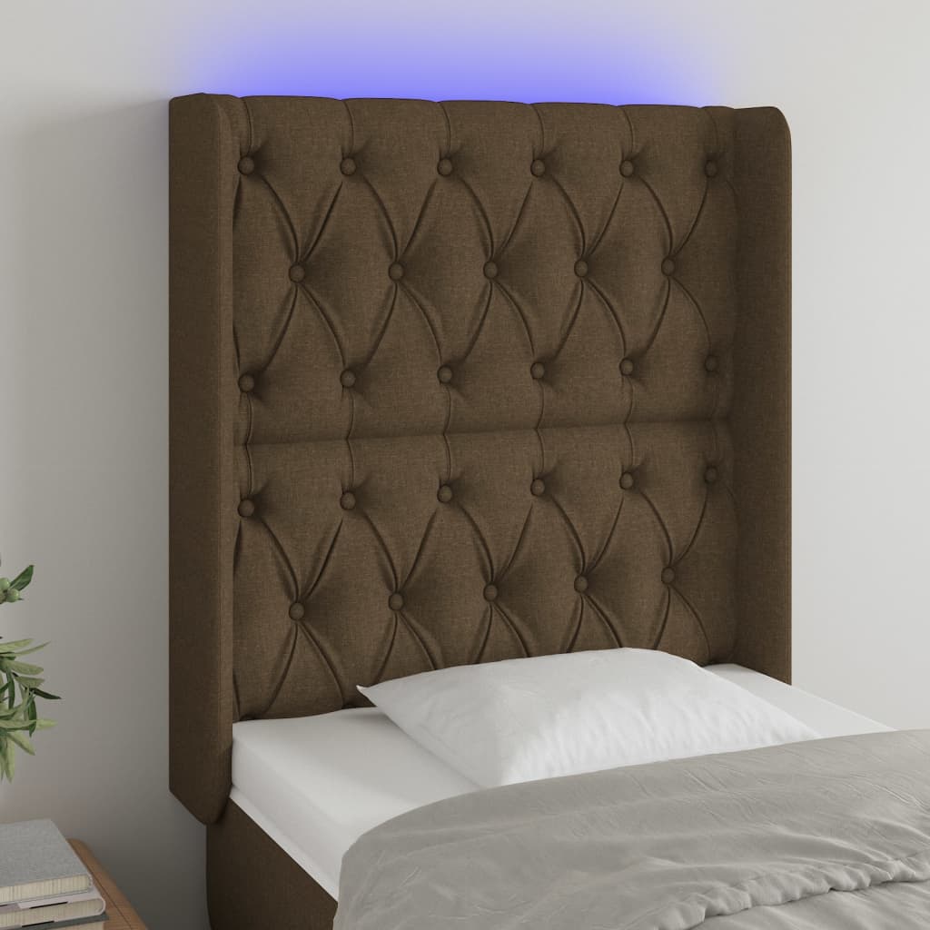 Čelo postele s LED tmavě hnědé 83 x 16 x 118/128 cm textil