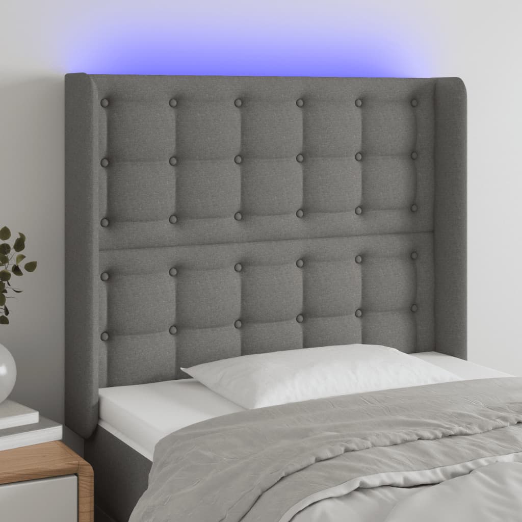 Čelo postele s LED tmavě šedé 103 x 16 x 118/128 cm textil
