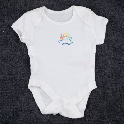 Chlapecké bílé body s dinosaurem