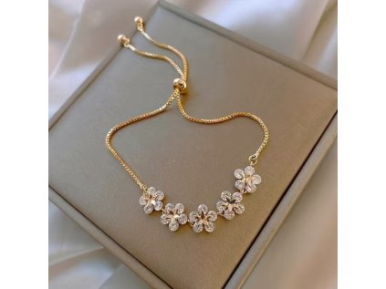 společenský zlatý náramek s kytičkami