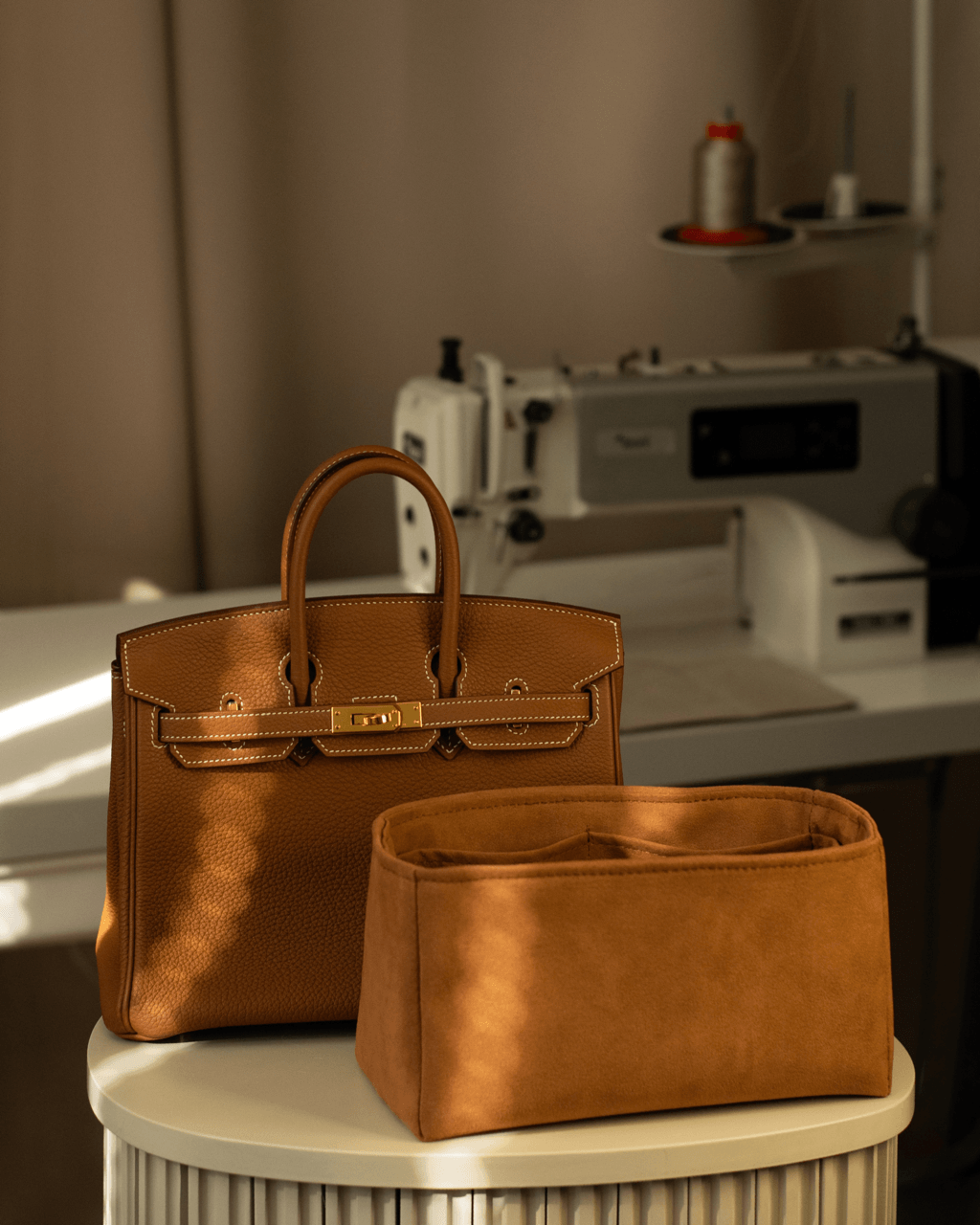 Beige Birkin with insert on a stand