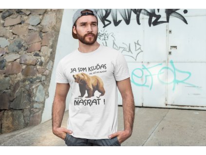 t shirt mockup of a man posing in front of a graffiti wall 28200