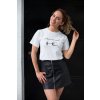 tee mockup of a girl with a leather skirt playing with her hair 26651
