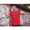 t shirt mockup of a fitness man posing against a wall with posters 28526(1)