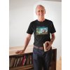 smiling man wearing a tshirt mockup holding a book in his house a20506(3)