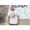 t shirt mockup of a man posing in front of a graffiti wall 28200