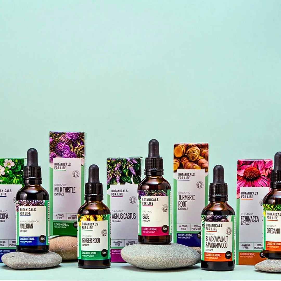 Botanicals For Life alcohol-free herbal extract range with dropper bottles and branded boxes displayed on stones.