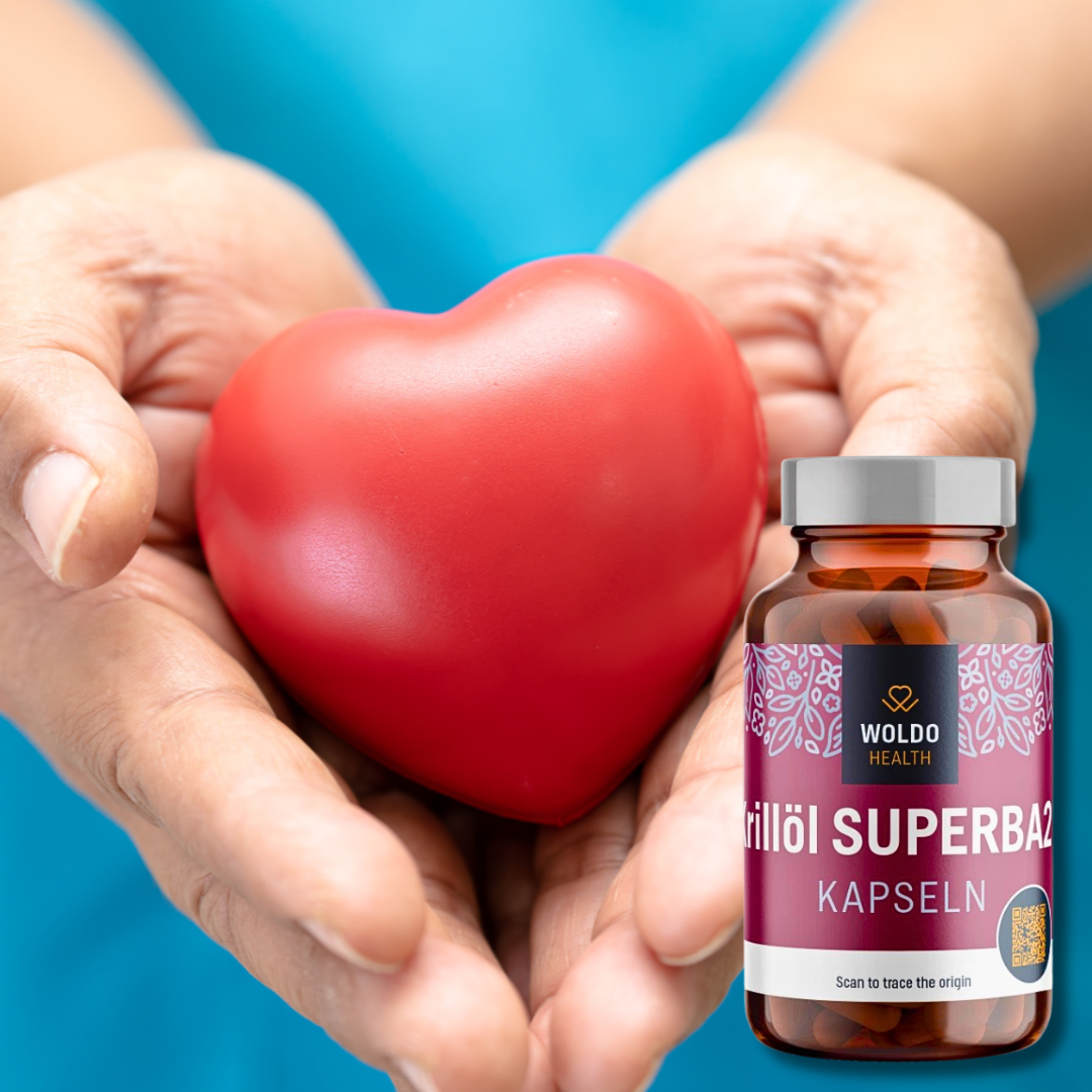 "Hands gently holding a red heart symbol, with a bottle of Woldo Health Krillöl Superba2 capsules placed beside it, representing heart-related wellbeing.