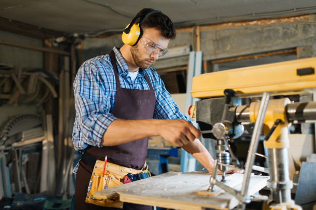 young-carpenter-focused-work_1098-13545