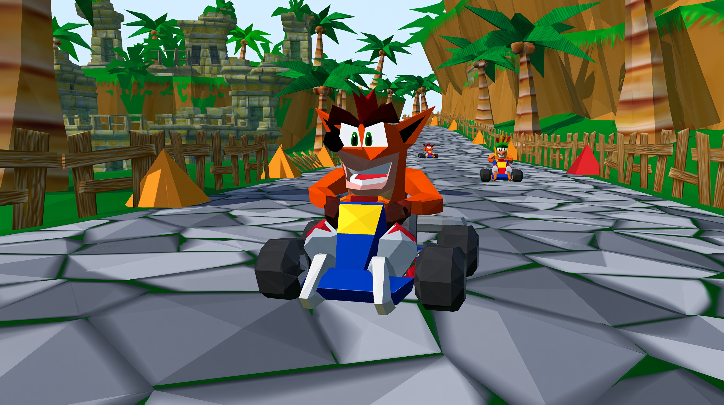 Crash Team Racing pro PlayStation 1 - ilustrační kart racing scéna s arkádovým závoděním, power-upy a tropickou tratí
