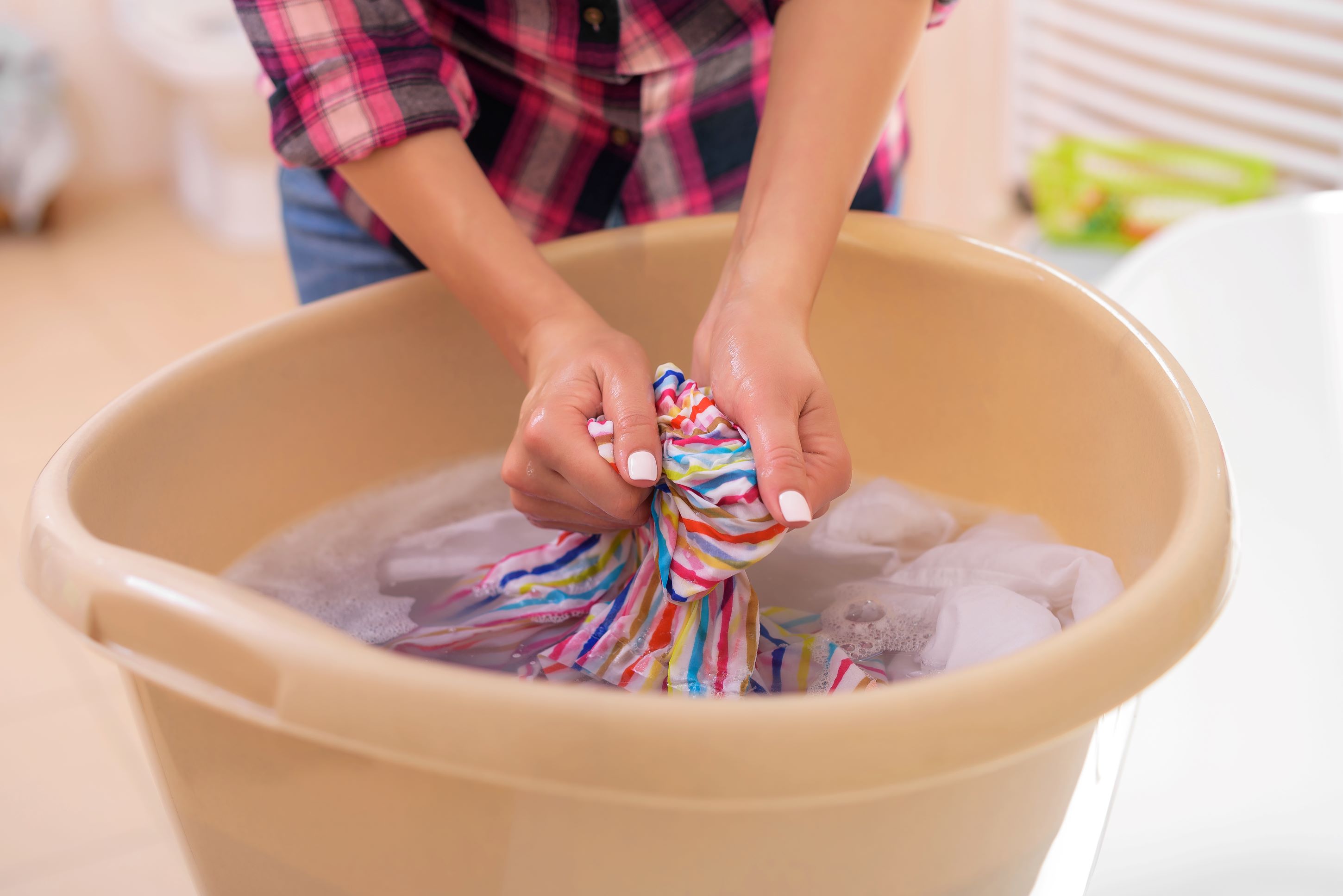 Hand Washing Multicoloured Laundry