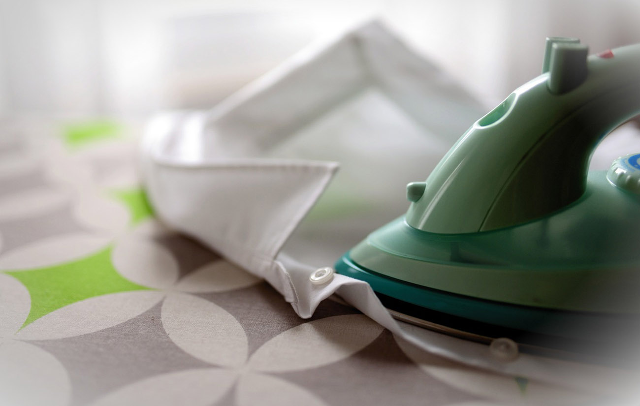 Iron on an ironing board