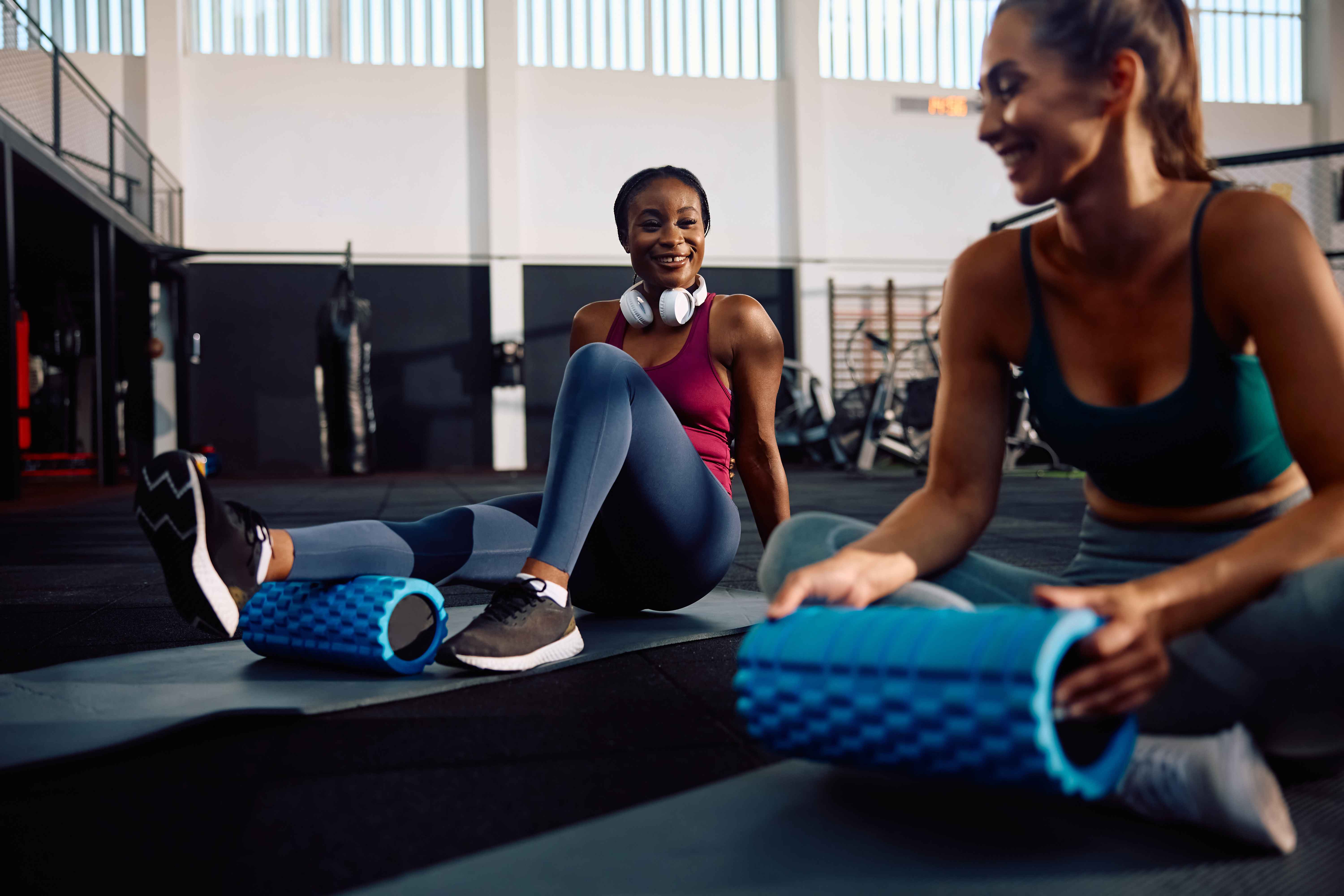 athletic-women-using-foam-roller-while-exercising-2024-12-13-18-24-35-utc_11zon