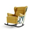 Žluté houpací křeslo s květinovým dekorem boků a černými nožkami Lorenzo