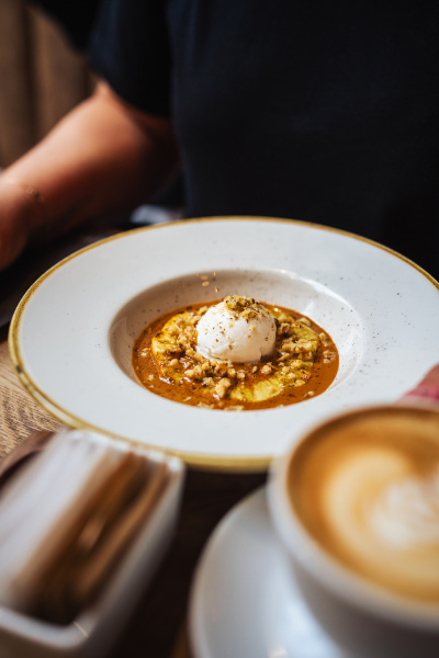 Grilled pineapple in butter, cane sugar, caramel sauce, coconut ice cream, crushed nuts