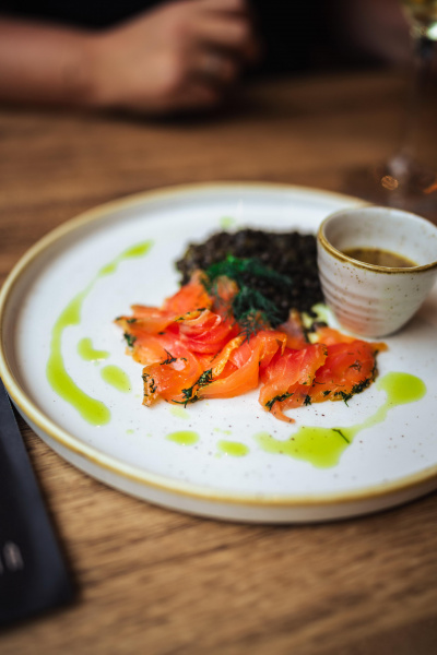 Marinated salmon, black lentils with green curry and coconut milk