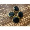 Černý vintage knoflík se zlatým okrajem