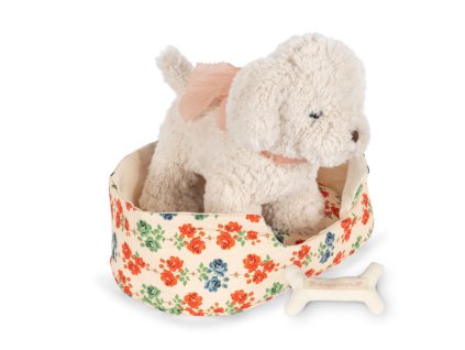 Plyšové štěně s mašličkou v roztomilém pelíšku s hračkami