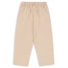 Dětské béžové kalhoty volné střihu pro holky i kluky od Konges Sløjd - zezadu