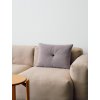 Levandulový polštář Dot ze směsi vlny od dánské značky HAY na sedačce