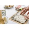 person arranging rice layer