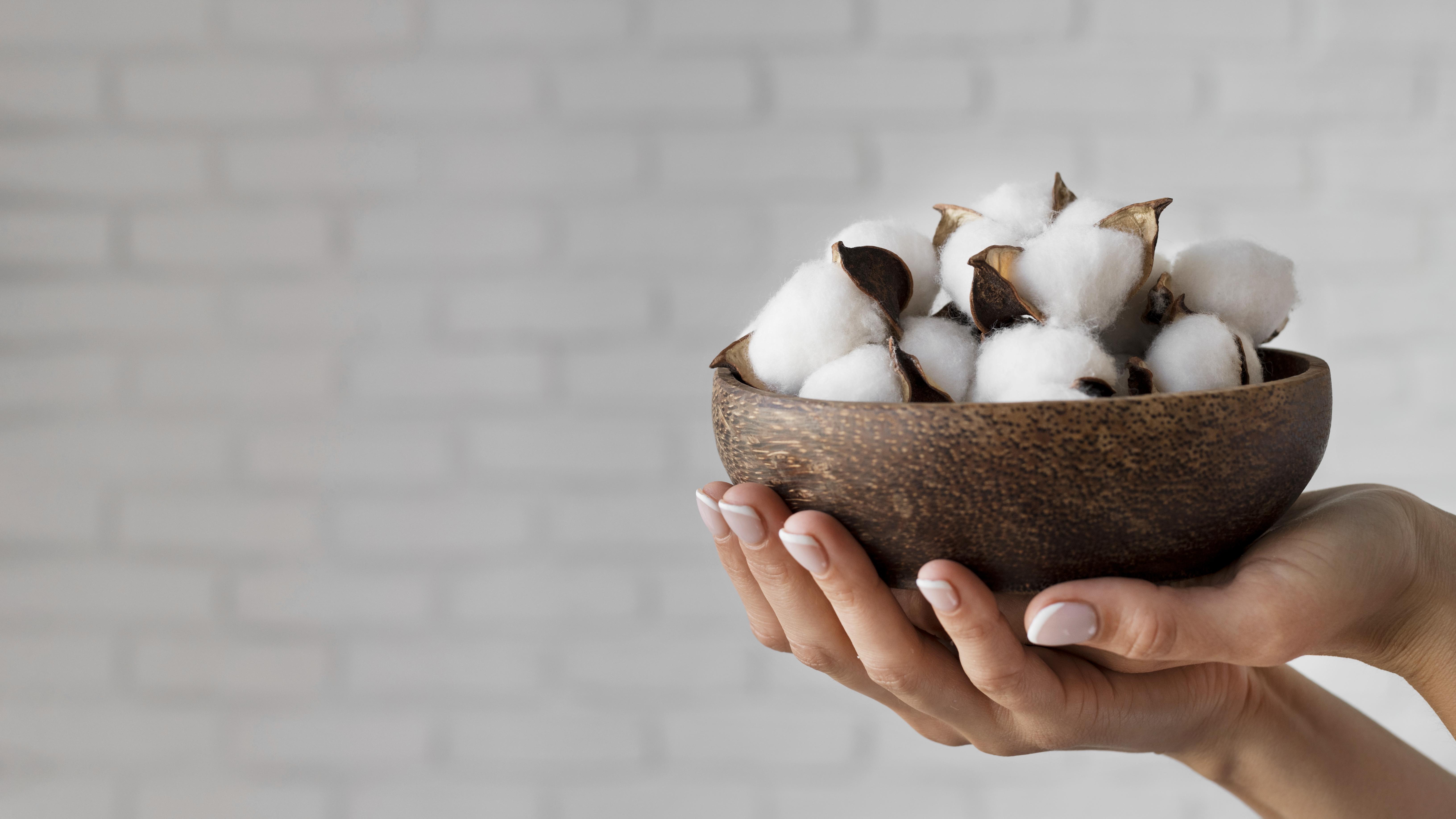 close-up-hands-holding-bowl-with-cotton