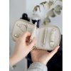 Kompaktní cestovní šperkovnice Stackers Oatmeal Compact Jewellery Roll | krémová