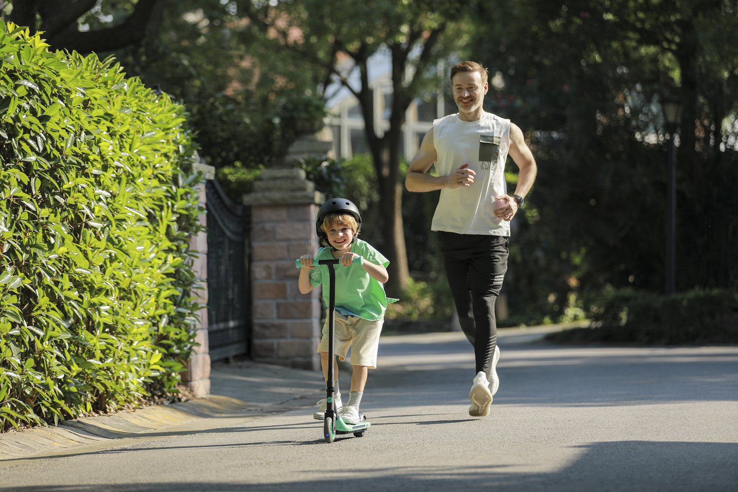 Ninebot eKickScooter ZING A6_Lifestyle picture_Boy riding and dad running-2140x1427_72