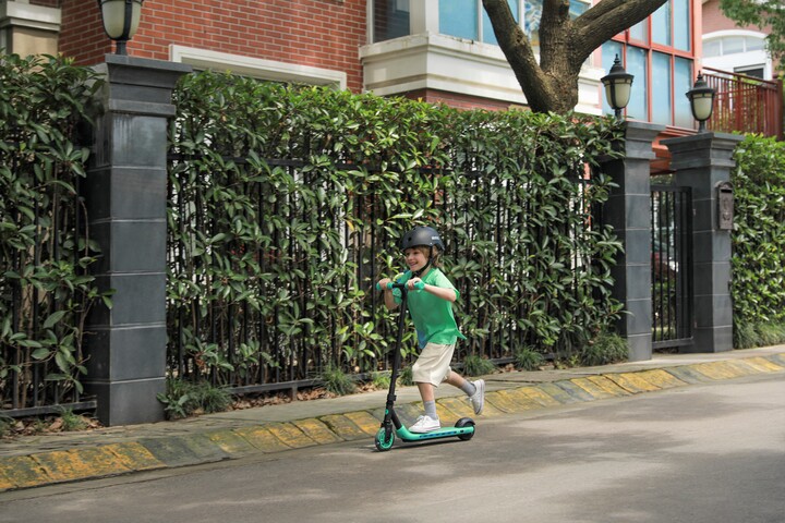 Ninebot eKickScooter ZING A6_Lifestyle picture_Boy riding side view-720x480_72