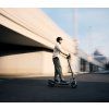 Ninebot F3 E,D Lifestyle picture KV guy riding blurred background