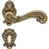 Mosazná klika BAROCCO 1520RB na rozetách 015