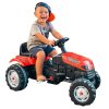 chlapček na červenom šliapacom traktore