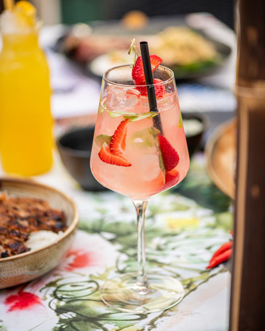 Thai Rose, a cocktail from Sia restaurant, contains pink strawberry gin, rose lemonade, Crémant rosé, lime, strawberry and Thai basil