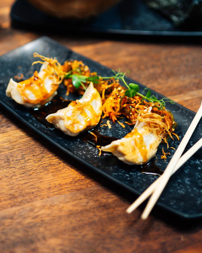 gyoza stuffed with duck meat, homemade cucumber kimchi