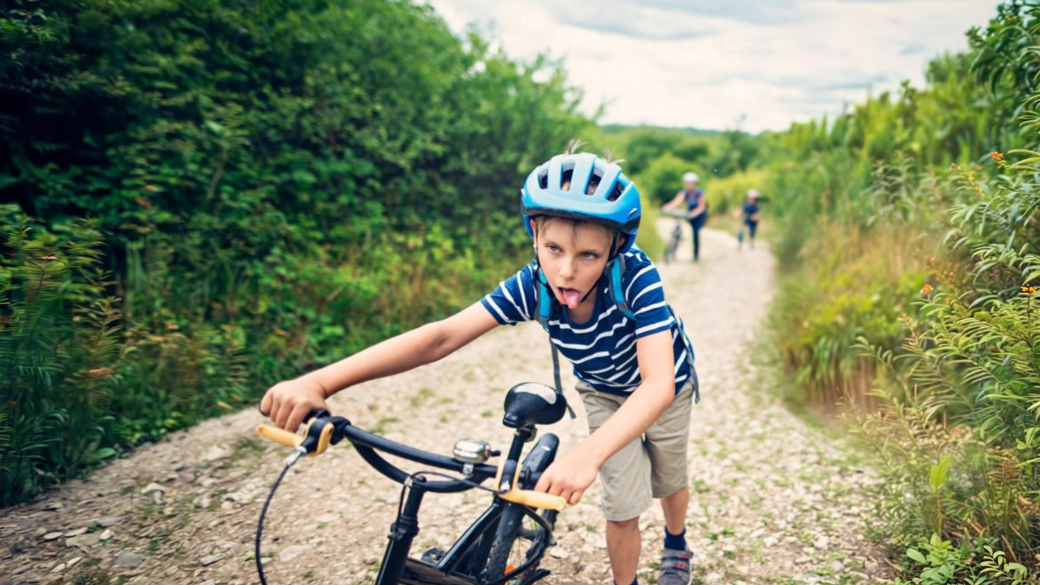 A child riding a heavy bicycle