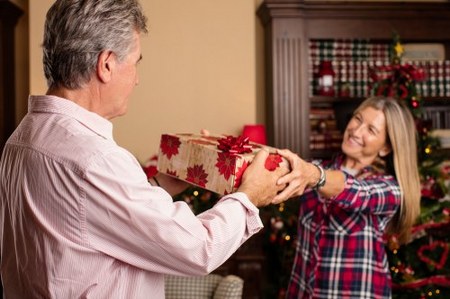 romantic-woman-giving-present-her-husband_500x332_450x299