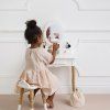 TV607 vanity table sitting on stool looking into mirror