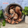 Nástěnná kovová cedule Veverka s žaludy. Průměr 20 cm