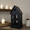 Kovový svícen vintage Dům. Barva černá