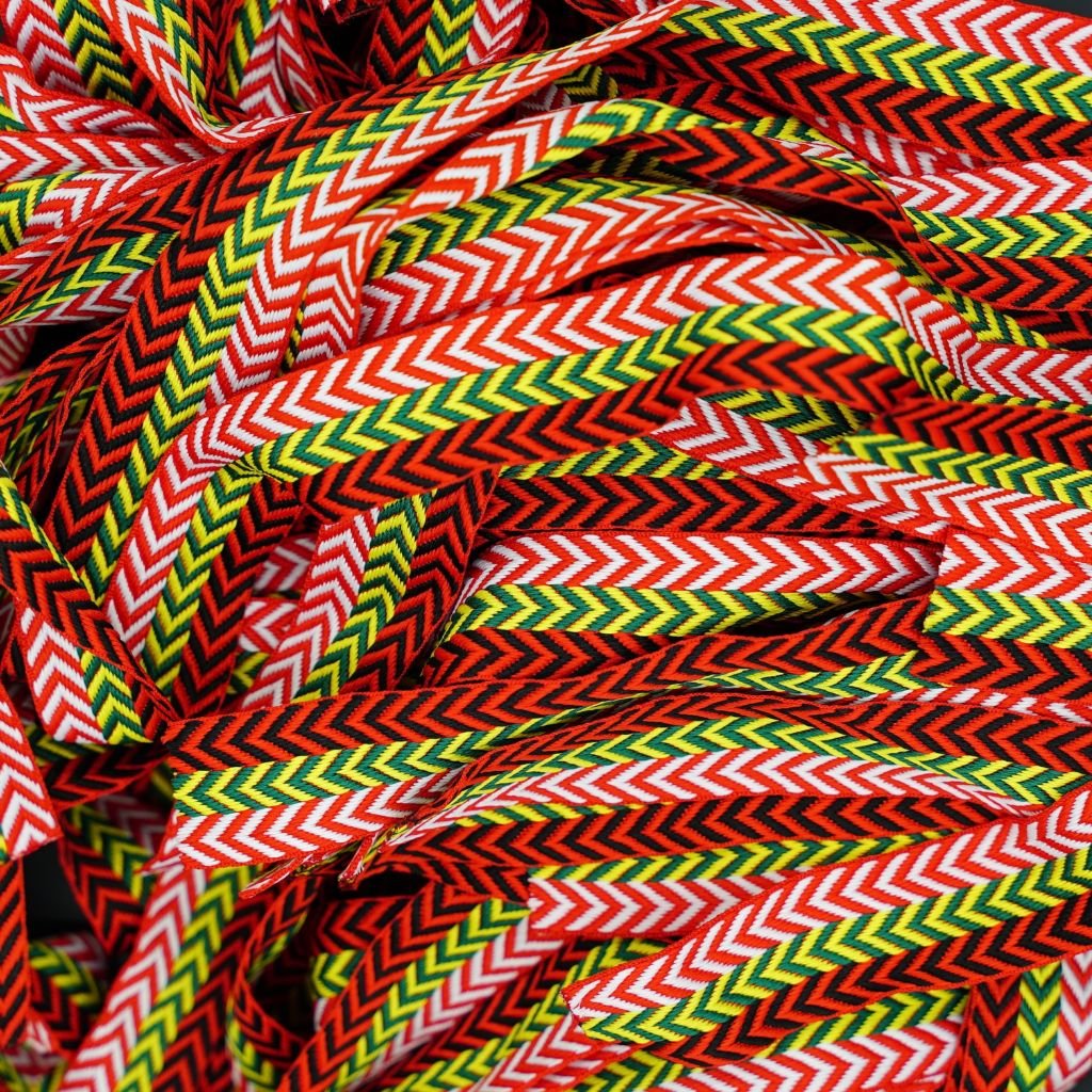 Lanvin Curb red–yellow–black fat shoelaces — extra-wide (~3 cm) gradient/tri-colour overlay laces for the signature chunky Curb look.