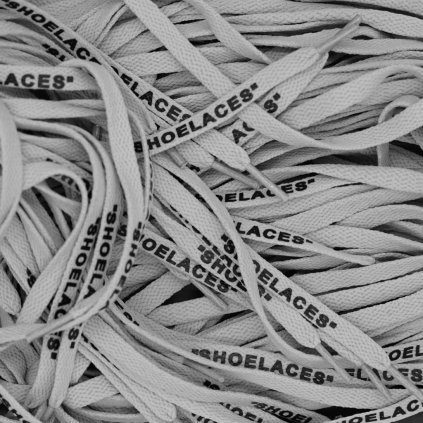 Grey Off-White flat replacement shoelaces with “SHOELACES” print — crisp flat profile for Nike Air Force 1, Air Jordan 1, Dunk and Air Max.