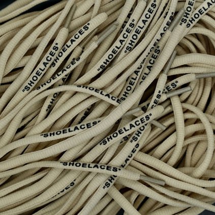Beige Off-White oval replacement shoelaces with “SHOELACES” print — made for Nike Air Force 1, Air Jordan, Dunk and Air Max.